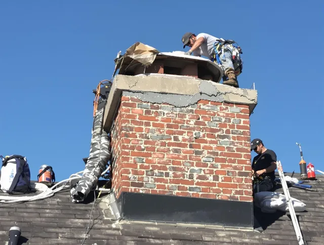 Temecula Chimney Sweep installing a custom chimney crown in Temecula, CA