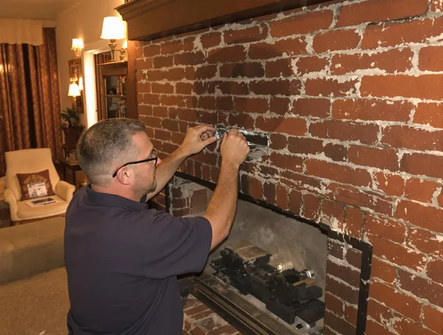 Temecula Chimney Sweep expert fixing a fireplace in Temecula, CA